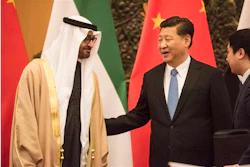 Abu Dhabi's Crown Prince and UAE Armed Forces Deputy Supreme Commander Mohammed bin Zayed Al Nayhan, left, talks with Chinese President Xi Jinping, center, during a signing ceremony at the Great Hall of the People in Beijing Monday, Dec. 14, 2015. (Fred Dufour/Pool Photo via AP)