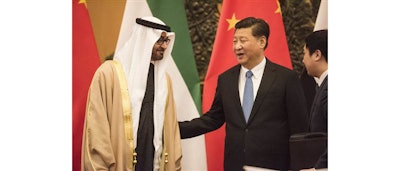 Abu Dhabi's Crown Prince and UAE Armed Forces Deputy Supreme Commander Mohammed bin Zayed Al Nayhan, left, talks with Chinese President Xi Jinping, center, during a signing ceremony at the Great Hall of the People in Beijing Monday, Dec. 14, 2015. (Fred Dufour/Pool Photo via AP)