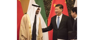 Abu Dhabi's Crown Prince and UAE Armed Forces Deputy Supreme Commander Mohammed bin Zayed Al Nayhan, left, talks with Chinese President Xi Jinping, center, during a signing ceremony at the Great Hall of the People in Beijing Monday, Dec. 14, 2015. (Fred Dufour/Pool Photo via AP)