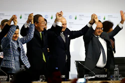 French President Francois Hollande, right, French Foreign Minister and president of the COP21 Laurent Fabius, second, right, United Nations climate chief Christiana Figueres and United Nations Secretary General Ban ki-Moon hold their hands up after the final conference at the COP21, the United Nations conference on climate change, in Le Bourget, north of Paris. (AP Photo/Francois Mori)