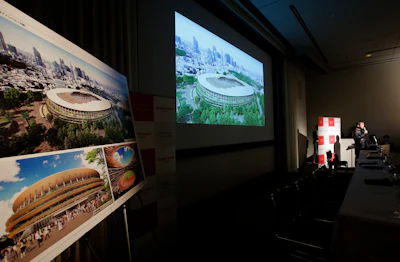 Japanese architect Kengo Kuma speaks during a press conference after his design for the 2020 Tokyo Olympic stadium was picked. (AP Photo/Shizuo Kambayashi)