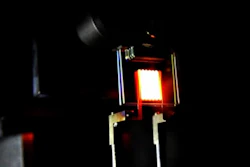 A proof-of-concept device built by MIT researchers demonstrates the principle of a two-stage process to make incandescent bulbs more efficient. (Image: MIT/the light's researchers)