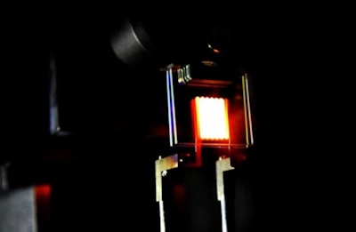 A proof-of-concept device built by MIT researchers demonstrates the principle of a two-stage process to make incandescent bulbs more efficient. (Image: MIT/the light's researchers)