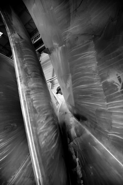 A worker is finishing a Francis hydroturbine. (Image credit: GE Power)