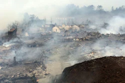 Smoke rises over the rubble of a fireworks factory after an explosion near Shangrao in southern China's Jiangxi province Wednesday Jan. 20, 2016. (Chinatopix via AP) CHINA OUT