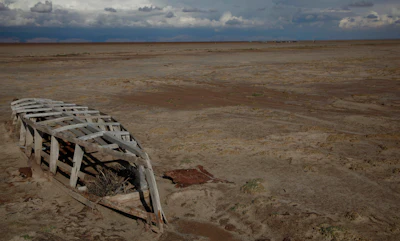 An abandoned boat lies on the dried up lake bed of Lake Poopo, on the outskirts of Untavi, Bolivia. (AP Photo/Juan Karita)
