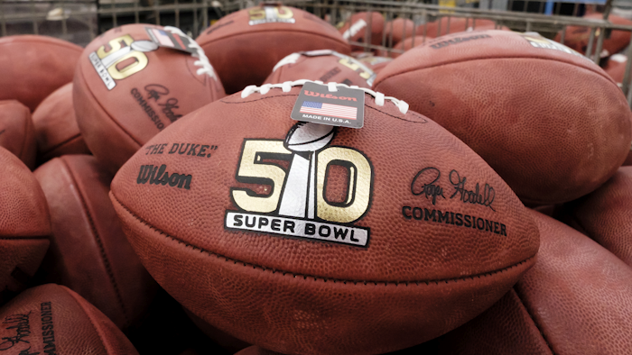 Official balls for the NFL Super Bowl 50 football game are seen in a bin prior to final inspection at the Wilson Sporting Goods Co. in Ada, Ohio, Tuesday, Jan. 26, 2016. The Denver Broncos will play the Carolina Panthers in the Super Bowl on Feb. 7 in Santa Clara, Calif. (AP Photo/Rick Osentoski)