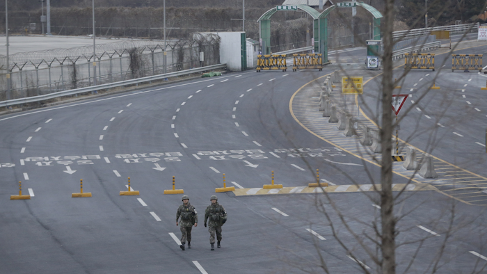 South Korean Army soldiers patrol at the customs, immigration and quarantine office near the border village of Panmunjom in Paju, South Korea, Thursday, Feb. 11, 2016. North Korea on Thursday ordered a military takeover of a factory park that was the last major symbol of cooperation with South Korea, saying Seoul's suspension of operations at the jointly run facility was a 'dangerous declaration of war.' (AP Photo/Ahn Young-joon)