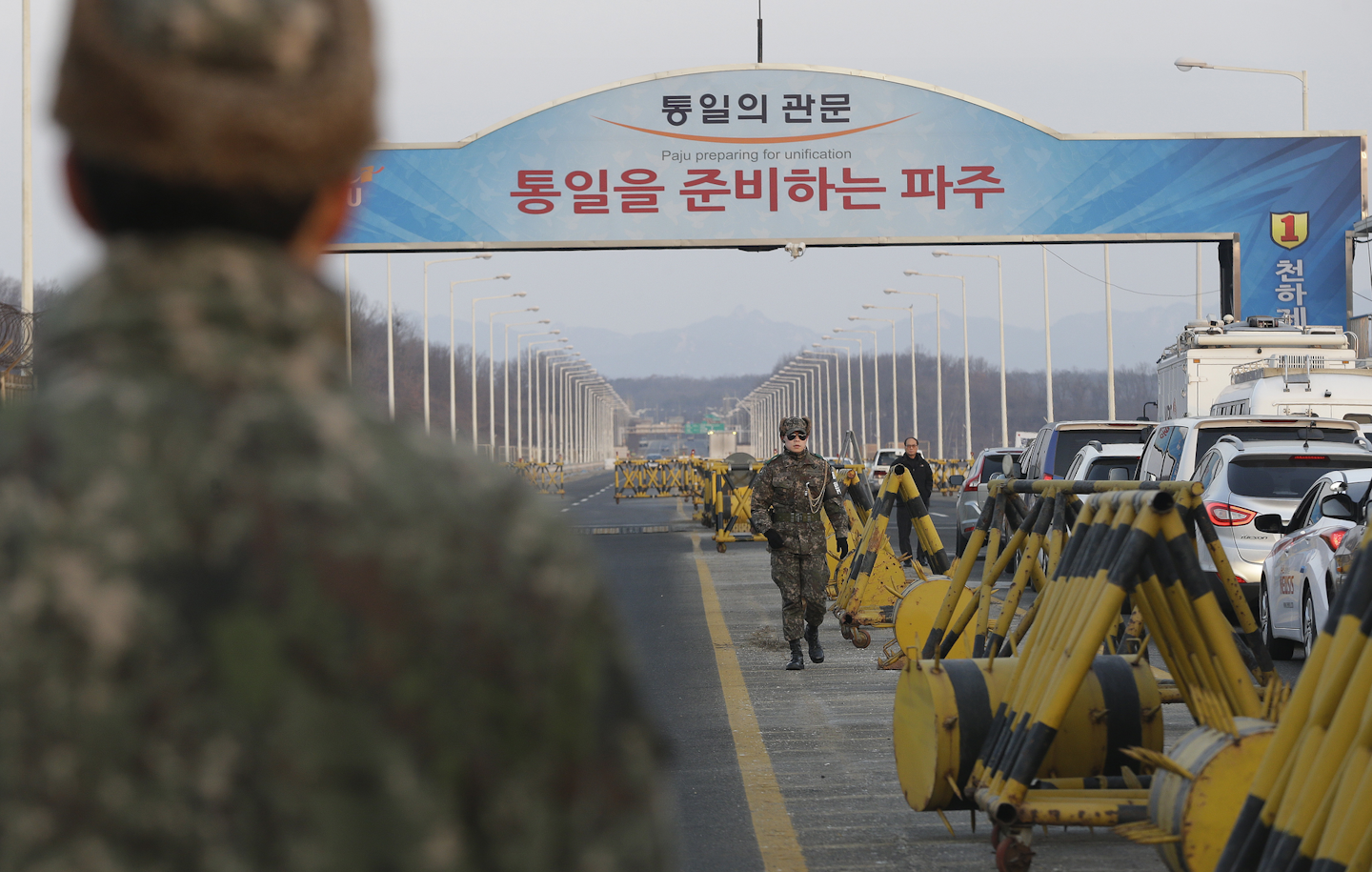 A South Korean army soldier walks on Unification Bridge, which leads to the demilitarized zone, near the border village of Panmunjom in Paju, South Korea. (AP Photo/Ahn Young-joon)