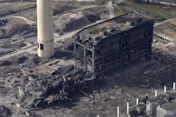 An aerial view of the site after a building collapsed, at Didcot Power Station, in Oxfordshire, England, Wednesday Feb. 24, 2016. An unused power station in southern England partially collapsed Tuesday, killing one person and injuring five others, British emergency services said. (Steve Parsons/PA via AP)