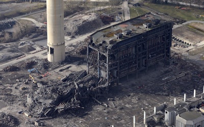 An aerial view of the site after a building collapsed, at Didcot Power Station, in Oxfordshire, England, Wednesday Feb. 24, 2016. An unused power station in southern England partially collapsed Tuesday, killing one person and injuring five others, British emergency services said. (Steve Parsons/PA via AP)
