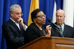 Valerie Wilson, center, school business administrator for the Newark Public Schools system, speaks at a news conference addressing the finding of lead levels earlier this month in Newark schools, Wednesday, March 9, 2016, in Newark, N.J. Standing with Wilson are Cristopher Cerf, left, Superintendent of Newark Public Schools, and Anthony Ambrose, acting director of public safety for Newark. (AP Photo/Julio Cortez)