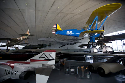 Aircrafts and other items are displayed during a media event to mark the reopening of the American Air Museum after it underwent a major redevelopment, at the Imperial War Museum of aviation in Duxford, England, Wednesday, March 16, 2016. (AP Photo/Matt Dunham)