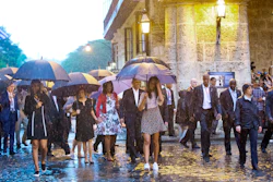 U.S. President Barack Obama, center, with his first lady Michelle Obama, daughters Malia and Sasha and first lady's mother Marian Robinson, take a walking tour of Old Havana in the rain, Sunday, March 20, 2016 in Havana, Cuba. Obama became the first U.S. president to visit the island in nearly 90 years. (AP Photo/Pablo Martinez Monsivais)