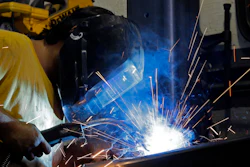 In this Monday, Sept. 14, 2015, file photo, welder Gabriel Gonzalez welds a support beam at a local welding shop in Hialeah, Fla. On Tuesday, May 17, 2016, the Federal Reserve reports on U.S. industrial production for April. (AP Photo/Alan Diaz, File)