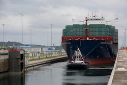The ship carrying more than 9,000 containers entered the newly expanded locks that will double the canal's capacity. (AP Photo/Moises Castillo)