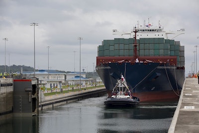 The ship carrying more than 9,000 containers entered the newly expanded locks that will double the canal's capacity. (AP Photo/Moises Castillo)
