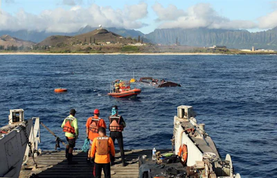 This 2015 photo provided by Northwest Energy Innovations shows crews installing the Azura wave energy device, which is converting the movement of waves into electricity at the Navy's Wave Energy Test Site at the Marine Corps base at Kaneohe Bay on Oahu in Hawaii. (Steven Kopf/Northwest Energy Innovations via AP)