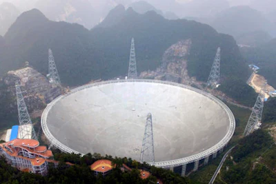 An aerial view shows the Five-hundred-meter Aperture Spherical Telescope (FAST) in the remote Pingtang county in southwest China's Guizhou province, Sunday, Sept. 25, 2016. (Chinatopix via AP)