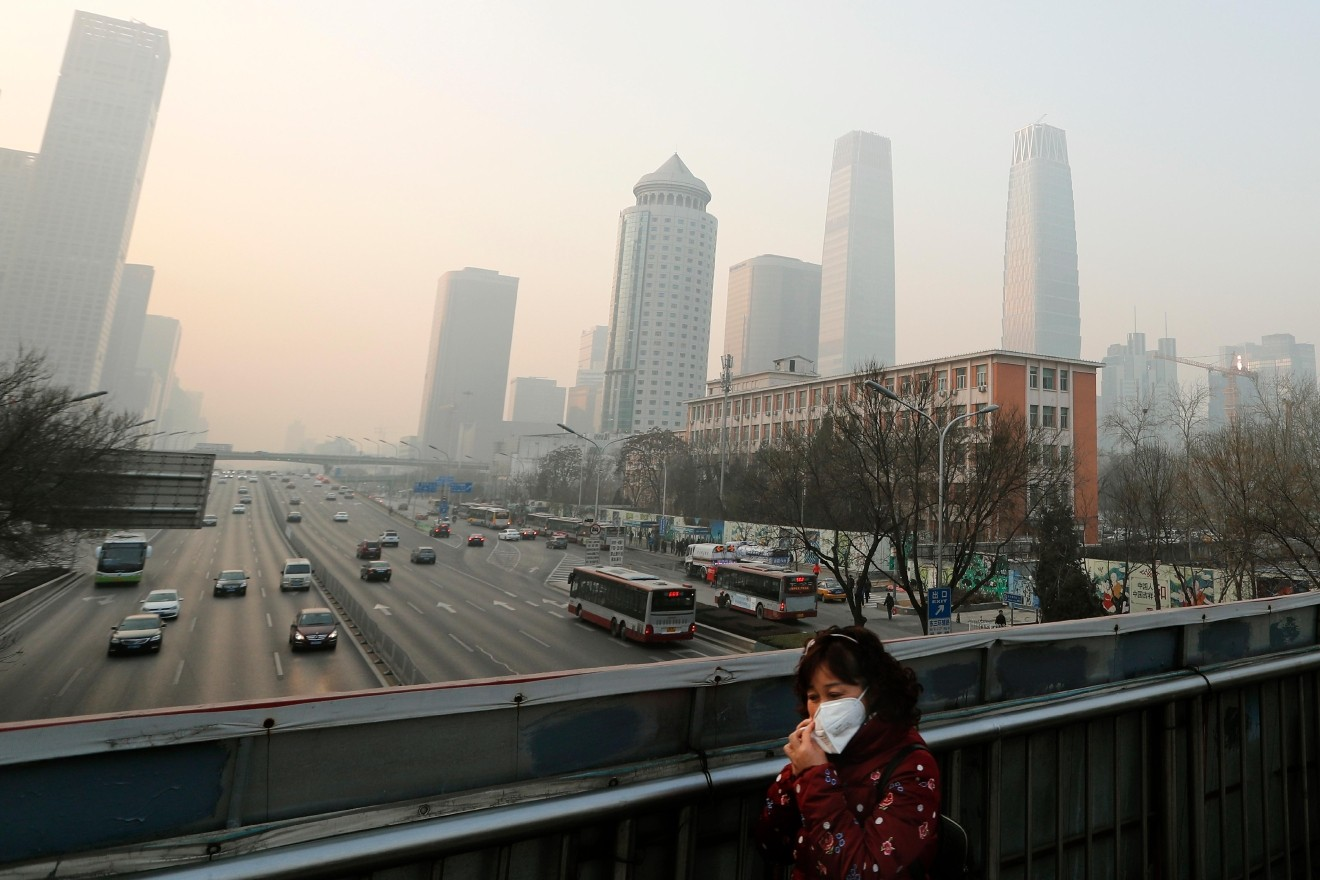 More than 700 companies stopped production in Beijing and traffic police were restricting drivers by monitoring their license plate numbers, state media reported. (AP Photo/Andy Wong)