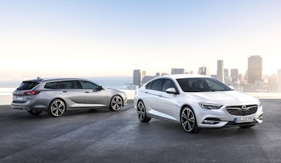 This undated image provided by car manufacturer Opel AG, shows a Opel Insignia Grand Sport, right, and the Insignia Sports Tourer station wagon. (Adam Opel AG via AP)