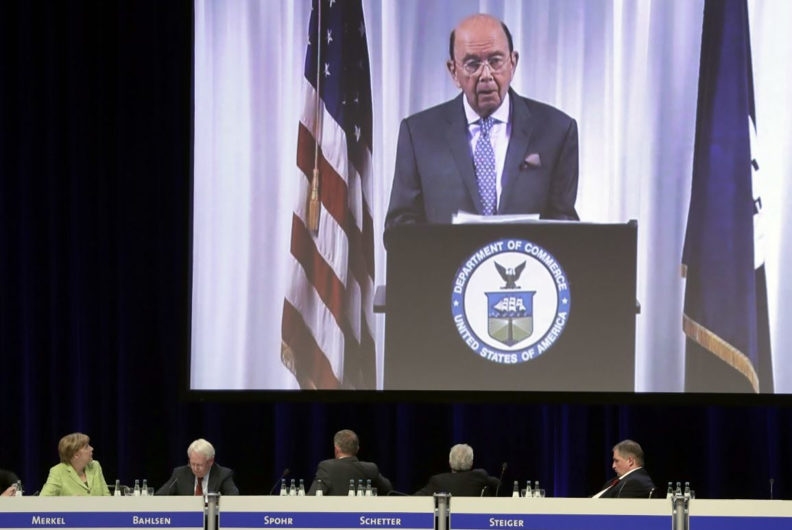 Commerce Secretary Wilbur Ross' speech is transmitted to a reception of the Economy Council of the German Christian Democratic Party (AP photo)