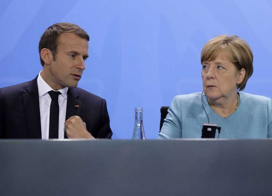 French President Emmanuel Macron and German Chancellor Angela Merkel at a press conference with European leaders (AP photo)
