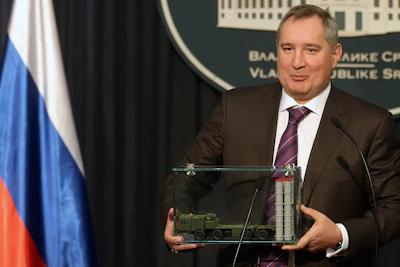 In this Monday, Jan. 11, 2016 file photo, Russian Deputy Prime Minister Dmitry Rogozin holds a model of an S-300 surface-to-air missile system at a news conference in Belgrade, Serbia. In May 2015, Rogozin invoked the X-37B unmanned space plane as evidence that his country’s space program was faltering. “The United States is pushing ahead,” he warned Russian lawmakers. Less than two weeks later, the hacking group Fancy Bear tried to penetrate the Gmail account of a senior engineer on the X-37B project at Boeing. (Marina Lopicic/Kurir via AP)
