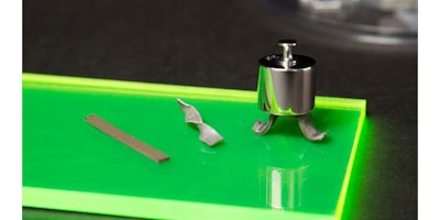 Examples of the new smart material, left to right: A flexible strip; a flexible strip that stiffened when twisted; a flexible strip transformed into a hard composite that can hold up a weight. Credit: Christopher Gannon/Iowa State University