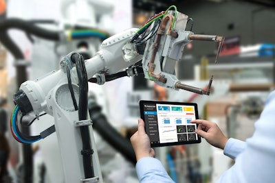 Engineer Hand Using Tablet, Heavy Automation Robot Arm Machine In Smart Factory Industrial With Tablet Real Time Monitoring System Application Industry 4th Iot Concept 687663970 3868x2579 (1)