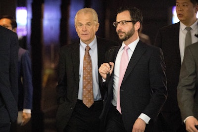 White House trade adviser Peter Navarro, left, leaves his hotel in Beijing, Friday, May 4, 2018. Chinese and U.S. officials met face-to-face Thursday to try and resolve a dispute over technology that has taken the world's two largest economies the closest they've ever come to a trade war. Image credit: AP Photo/Mark Schiefelbein