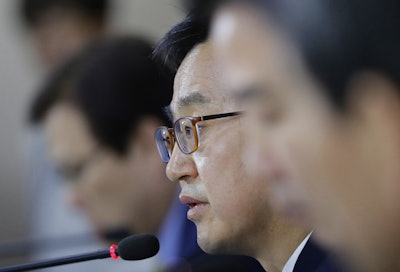 South Korean Finance Minister Kim Dong-yeon speaks to the media during a briefing at the government complex in Seoul, South Korea, Thursday, May 10, 2018. Image credit: AP Photo/Lee Jin-man