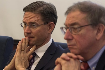 European Commission Vice President Jyrki Katainen at left listens near Jean-Luc Demarty, Director General for Trade, European Commission during a press conference in Beijing, China, Monday, June 25, 2018. Image credit: AP Photo/Ng Han Guan