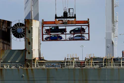In this July 13, 2017, file photo, a crane transporting vehicles operates on a container ship at the Port of Oakland, in Oakland, Calif. Image credit: AP Photo/Ben Margot, File