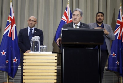 New Zealand's Acting Prime Minister Winston Peters, center, and Defense Minister Ron Mark, left, talk to reporters in Wellington, New Zealand Monday, July 9, 2018. Image credit: AP Photo/Nick Perry