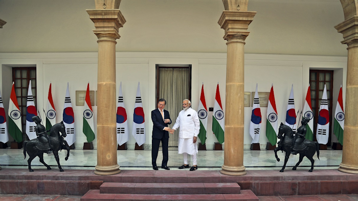 South Korean President Moon Jae-in, left, shakes hand with Indian Prime Minister Narendra Modi before their meeting in New Delhi, India, Tuesday, July 10, 2018. Image credit: AP Photo/Manish Swarup
