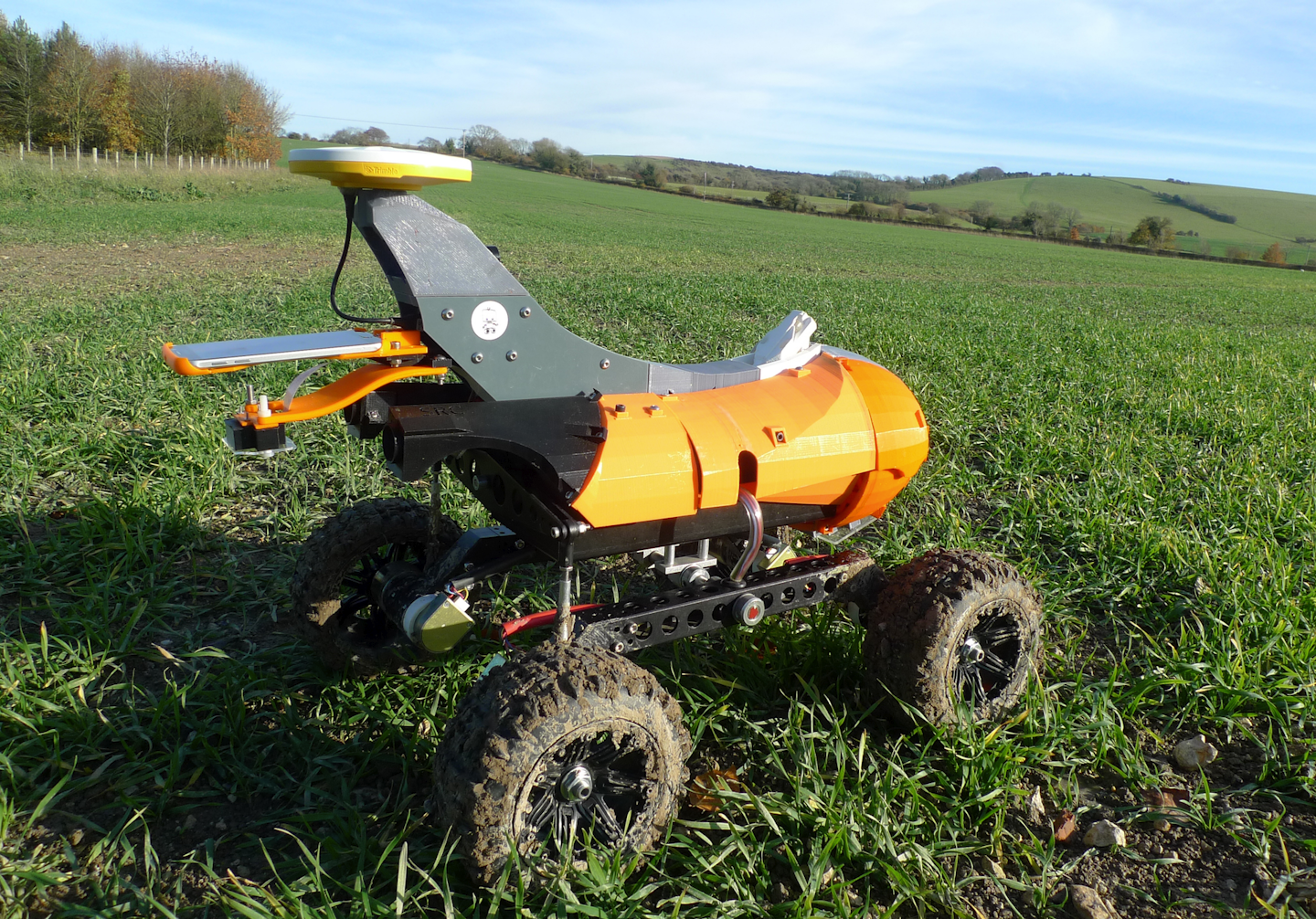 A farming robot named 'Tom' produced by Small Robot Company as part of a field trial to develop new farm technologies, in East Meon, southern England, Friday Nov. 30, 2018. The “agri-tech” startup company is developing lightweight autonomous machines that can carry out precision “seeding, feeding and weeding” in the hope of transforming food production. (AP Photo / Kelvin Chan)