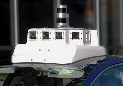 In this Dec. 18, 2018, photo a sensor and camera array on top of one of the test vehicles from Argo AI, Ford's autonomous vehicle unit, is parked at the company offices in Pittsburgh. Even the most optimistic experts say it will be 10 years before self-driving vehicles are everywhere, but others believe it will take decades. The biggest reasons are camera and laser sensors that can’t see through heavy snow or figure out where to go if lane lines are covered. (AP Photo/Keith Srakocic)