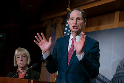 In this Dec. 19, 2018, file photo, Sen. Ron Wyden, D-Ore., joined at left by Sen. Patty Murray, D-Ore., speaks during a news conference to press Congress to intervene on behalf of the Affordable Care Act, after a federal judge in Texas ruled it unconstitutional, on Capitol Hill in Washington. Wyden has proposed legislation that would give states a free hand to allow legal marijuana markets without the threat of federal criminal intervention. (AP Photo/J. Scott Applewhite, File)