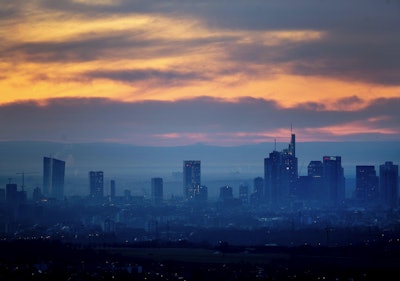 An orange sky is seen over the banking district of Frankfurt, Germany, on Tuesday, Feb. 26, 2019. Image credit: AP Photo/Michael Probst
