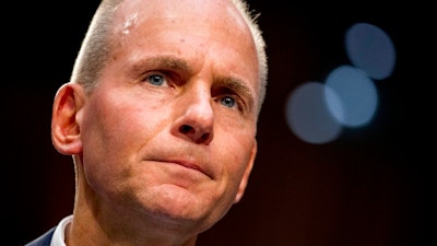 In this Oct. 29, 2019, file photo Boeing Company President and Chief Executive Officer Dennis Muilenburg appears before a Senate Committee on Commerce, Science, and Transportation hearing on 'Aviation Safety and the Future of Boeing's 737 MAX' on Capitol Hill in Washington. Muilenburg is resigning amid ongoing problems at the company over the troubled Max 737 aircraft. The board of directors said Monday, Dec. 23 that Muilenburg is stepping down immediately. The board's current chairman David Calhoun will become president and CEO on Jan. 13, 2020.