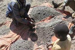 François and his 13-year-old son, Charles, sort stones before taking them to a nearby trading house that buys the ore, Democratic Republic of Congo, 2016.
