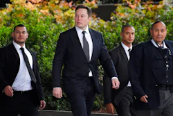 Tesla CEO Elon Musk, second from left, arrives at U.S. District Court Wednesday, Dec. 4, 2019, in Los Angeles. Musk is going on trial for his troublesome tweets in a case pitting the billionaire against a British diver he allegedly dubbed a pedophile.