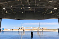 In this Aug. 15, 2019 file photo, Virgin Galactic ground crew guide the company's carrier plane into the hangar at Spaceport America following a test flight over the desert near Upham, New Mexico. Virgin Galactic is on the verge of making more history in 2020 following an 'incredible' year of progress, the chief executive of billionaire Richard Branson's space tourism venture said Thursday.