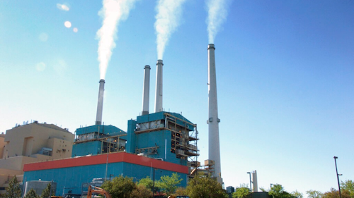In this July 1, 2013, file photo, gas emissions rises from a coal-burning power plant in Colstrip, Mont. One of the largest coal-fired power plants in the western U.S. will close two of its four units by Saturday, Jan. 4, 2020, as the Montana facility edges toward an eventual total shutdown.