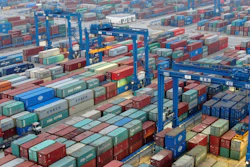 In this Jan. 14 photo, shipping containers are stacked at a dockyard on the Yangtze River in Nantong in eastern China's Jiangsu Province.