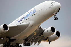 In this June 18, 2015, file photo, an Airbus A380 takes off for its demonstration flight at the Paris Air Show in Le Bourget airport, north of Paris. Airbus says it has reached potential settlement agreements with financial investigators in the U.S., Britain and France. British and French authorities are investigating alleged fraud and bribery related to Airbus' use of outside consultants to sell planes.