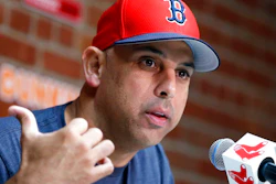 In this Sept. 9, 2019, file photo, Boston Red Sox manager Alex Cora talks about the dismissal of president of baseball operations Dave Dombrowski, during a news conference before the team's baseball game against the New York Yankees in Boston. Cora was fired by the Red Sox on Tuesday, Jan. 14, 2020, a day after baseball Commissioner Rob Manfred implicated him in the sport's sign-stealing scandal.