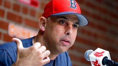 In this Sept. 9, 2019, file photo, Boston Red Sox manager Alex Cora talks about the dismissal of president of baseball operations Dave Dombrowski, during a news conference before the team's baseball game against the New York Yankees in Boston. Cora was fired by the Red Sox on Tuesday, Jan. 14, 2020, a day after baseball Commissioner Rob Manfred implicated him in the sport's sign-stealing scandal.