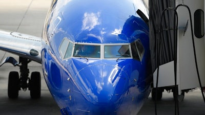 In this Sept. 9, 2019, file photo Southwest pilots prepare for a flight at Tampa International Airport in Tampa, Fla. Southwest Airlines Co. reports financial results Thursday, Jan. 23, 2020.